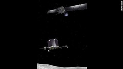 ロゼッタから着陸機「フィラエ」が彗星に向かって飛んでいく（想像図）＝ESA提供