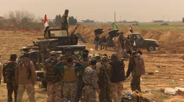 イラク軍の兵士ら。ティクリートの奪還へ向けて攻勢を続けている
