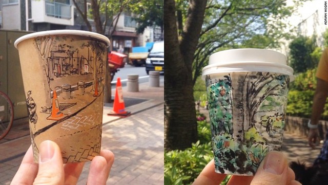 紙のコーヒーカップに東京の風景を描く＝エイドリアン・ホーガンさん提供