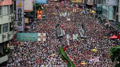 香港で抗議デモ、１００万人参加か　中国本土への容疑者移送条例に反対 